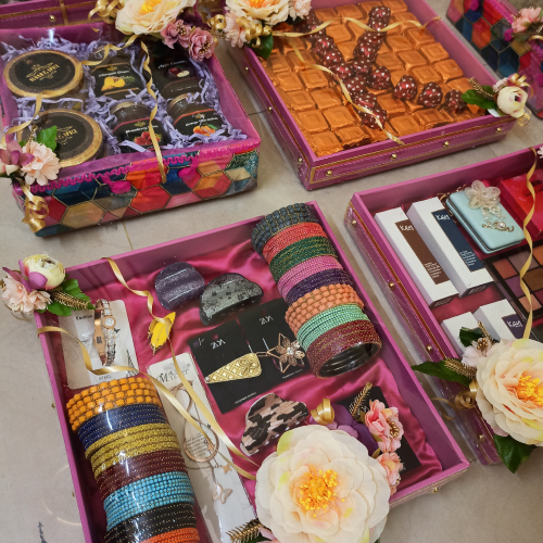 Gift tray with assorted bangles, hairclips and other decorative items