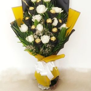 Bouquet of Ferrero Rocher chocolates, with white roses and yellow wrapping paper