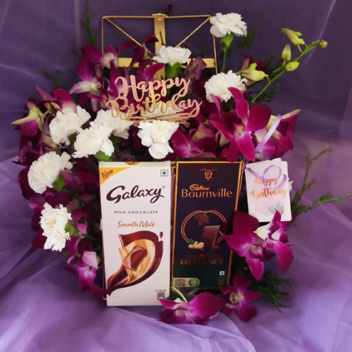 Violet coloured Birthday hamper with luxury chocolate bars and violet flowers