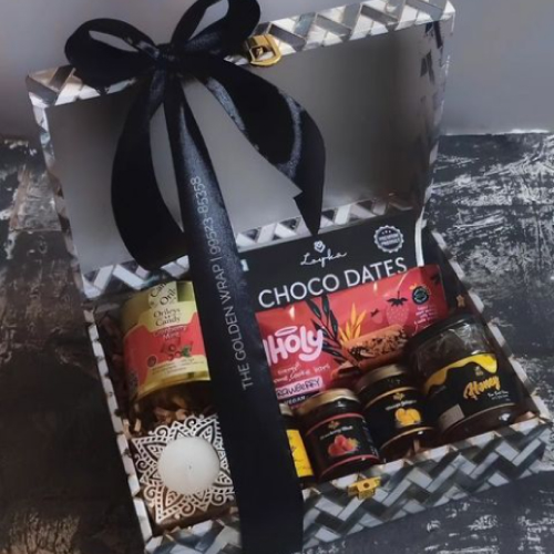 Black and white gift box, with black ribbon and assorted dates and jams