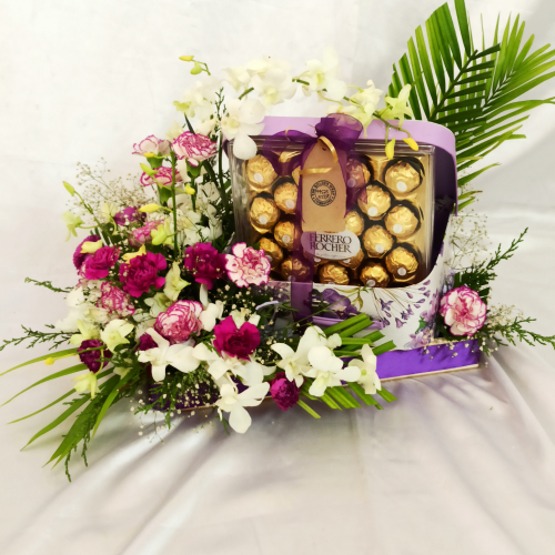 Violet gift hamper with Ferrero Rocher box and White and green foliage