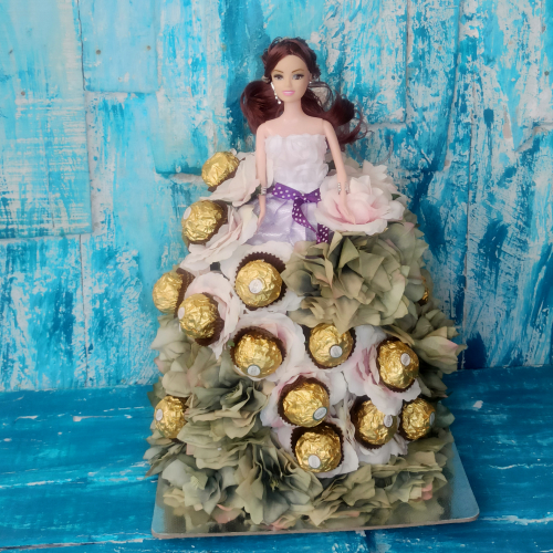 A barbie doll in a lavender dress with a Ferrero Rocher studded Skirt