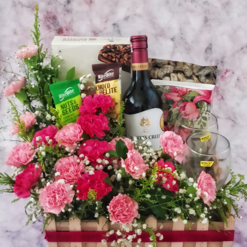 Gift tray with wine, wine glasses, chocolate and Pink coloured flowers