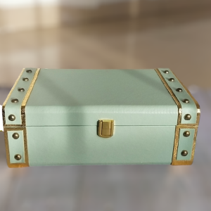 Teal box with gold corners and gold lock